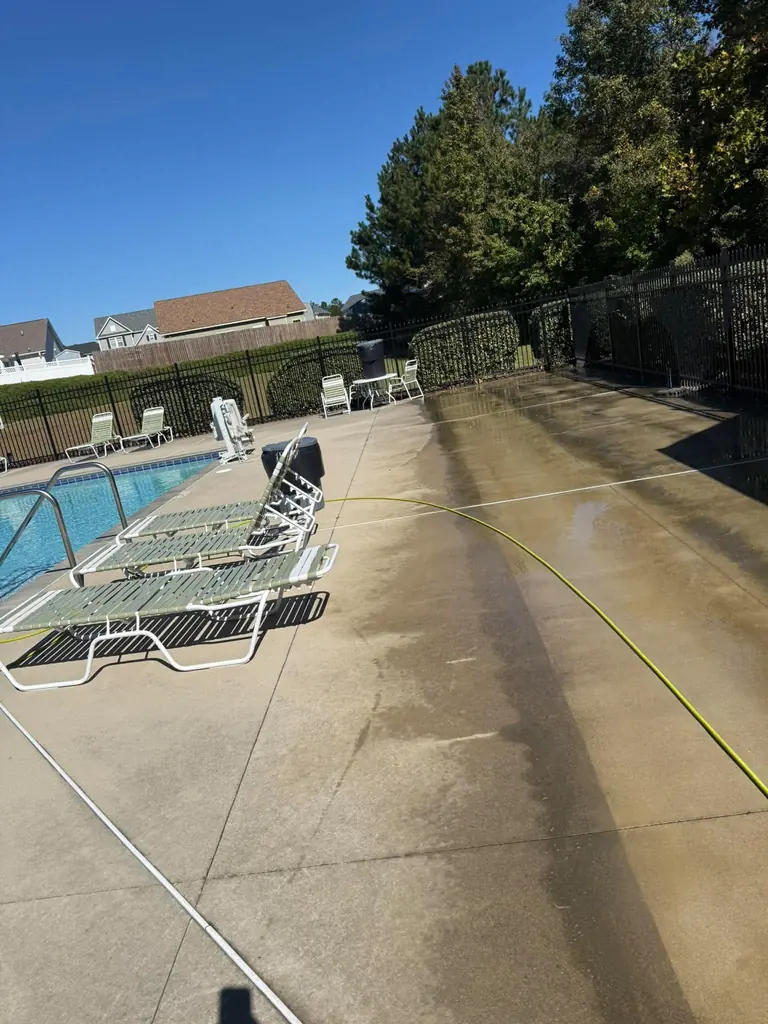 Pool deck cleaning in progress