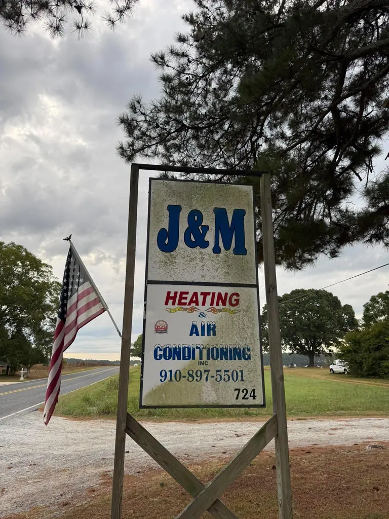 J&M Heating & Air sign before cleaning
